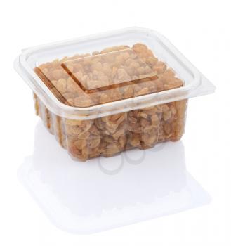 raisins in a transparent plastic container isolated on a white background with clipping path