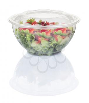 vegetable salad in a disposable plastic plate isolated with clipping path