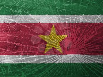 Isolated broken glass or ice with a flag, Suriname