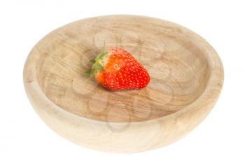 One fresh strawberries in a wooden bowl