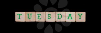 Tuesday spelled out in old wooden blocks