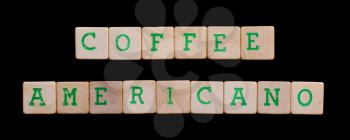 Green letters on old wooden blocks (coffee, americano)