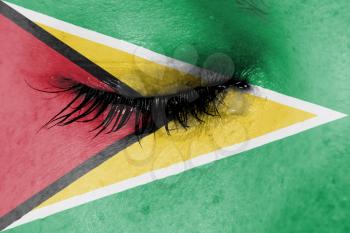Crying woman, pain and grief concept, flag of Guyana