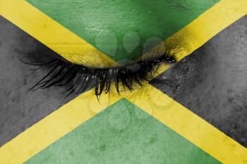 Crying woman, pain and grief concept, flag of Jamaica
