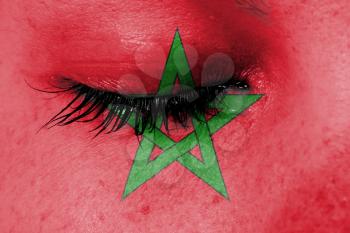 Crying woman, pain and grief concept, flag of Morocco