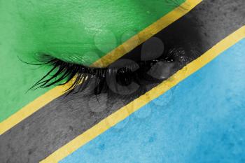 Crying woman, pain and grief concept, flag of Tanzania