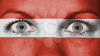 Close up of eyes. Painted face with flag of Austria