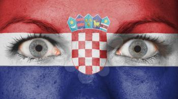 Close up of eyes. Painted face with flag of Croatia
