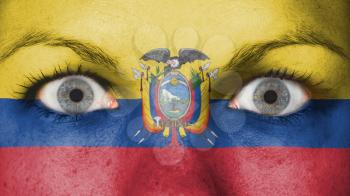 Close up of eyes. Painted face with flag of Equador