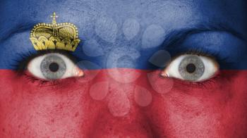 Close up of eyes. Painted face with flag of Liechtenstein