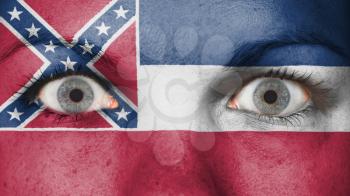 Close up of eyes. Painted face with flag of Mississippi