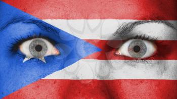 Close up of eyes. Painted face with flag of Puerto Rico