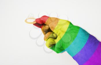 Male giving a condom on a white background, rainbow flag pattern