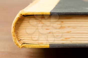 Close-up of an old book on a wooden table