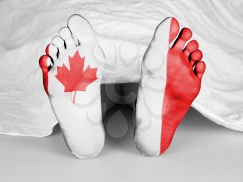 Dead body under a white sheet, flag of Canada