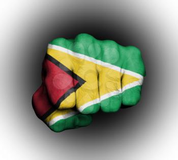 Fist of a man punching, flag of Guyana