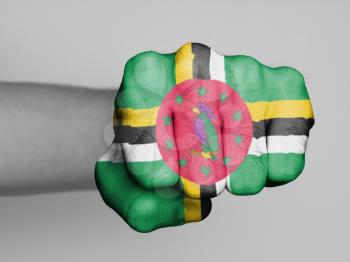 Fist of a man punching, flag of Dominica