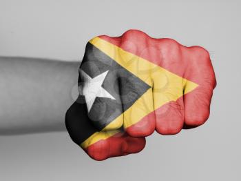 Fist of a man punching, flag of East Timor