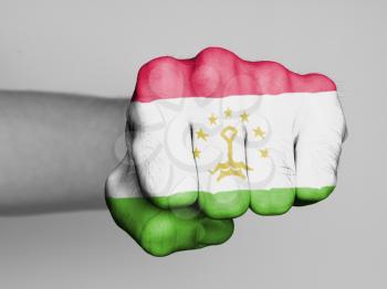 Fist of a man punching, flag of Tajikistan
