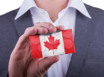 Businessman showing card, matte paper effect, Canada