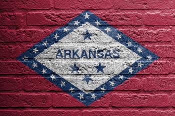 Brick wall with a painting of a flag isolated, Arkansas