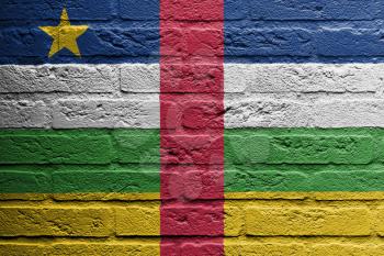 Brick wall with a painting of a flag isolated, Central African Republic