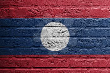 Brick wall with a painting of a flag isolated, Laos