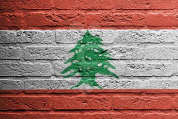 Brick wall with a painting of a flag isolated, Lebanon
