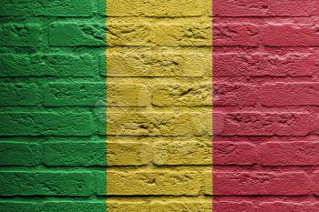 Brick wall with a painting of a flag isolated, Mali