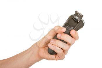 Hand holding an electric shaver isolated over a white background
