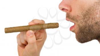 Man with beard is holding an unused cigar in his hand