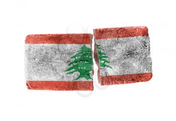 Rough broken brick, isolated on white background, flag of Lebanon
