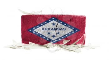 Brick with broken glass, violence concept, flag of Arkansas