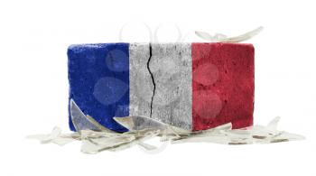 Brick with broken glass, violence concept, flag of France