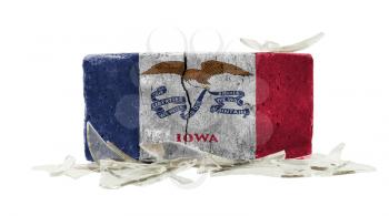 Brick with broken glass, violence concept, flag of Iowa