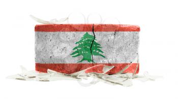 Brick with broken glass, violence concept, flag of Lebanon