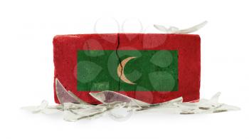 Brick with broken glass, violence concept, flag of Maldives