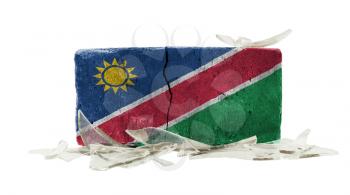 Brick with broken glass, violence concept, flag of Namibia