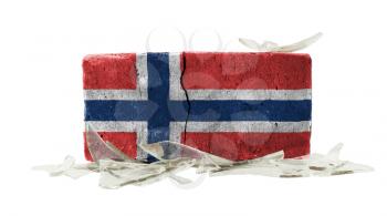 Brick with broken glass, violence concept, flag of Norway