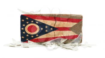 Brick with broken glass, violence concept, flag of Ohio