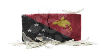 Brick with broken glass, violence concept, flag of Papua New Guinea