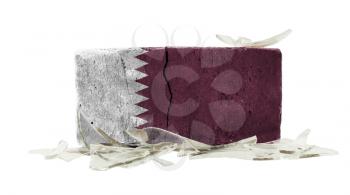 Brick with broken glass, violence concept, flag of Qatar