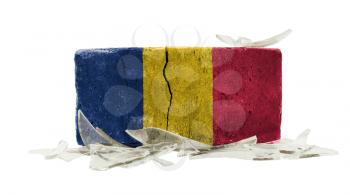 Brick with broken glass, violence concept, flag of Romania