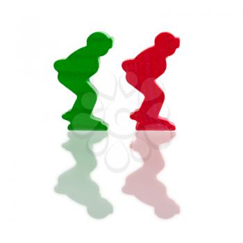 Two colored pawns isolated on a white background, ice skaters