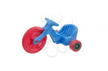 Small blue tricycle toy, isolated on white