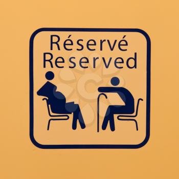 Sign saying reserved for pregnant women and the elderly