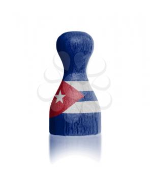 Wooden pawn with a painting of a flag, Cuba