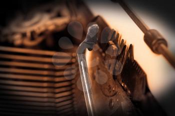 Close-up of an old retro typewriter with paper, warm