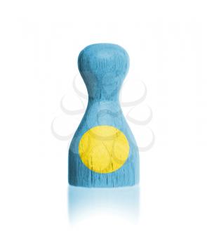 Wooden pawn with a painting of a flag, Palau