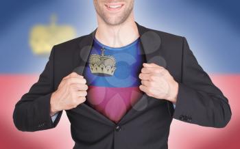 Businessman opening suit to reveal shirt with flag, Liechtenstein